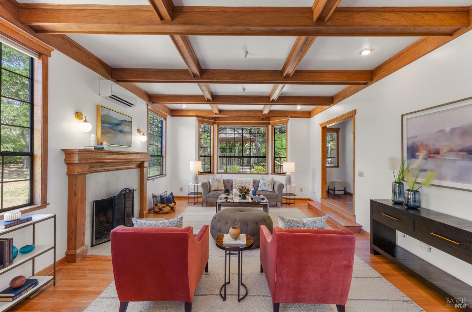10 Lockton Lane Novato, CA 94945 - Photo 11 of 68 Living room view toward the dining area, highlighting the home’s open flow, warm wood detailing, and connection between formal gathering spaces.
