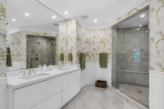 a bathroom with a glass shower door