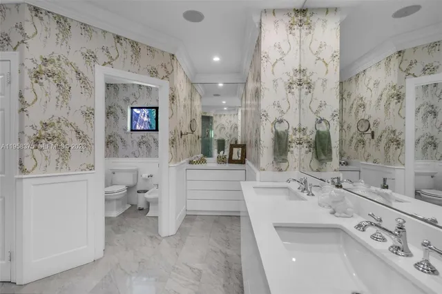 a bedroom with a bed and a view of balcony