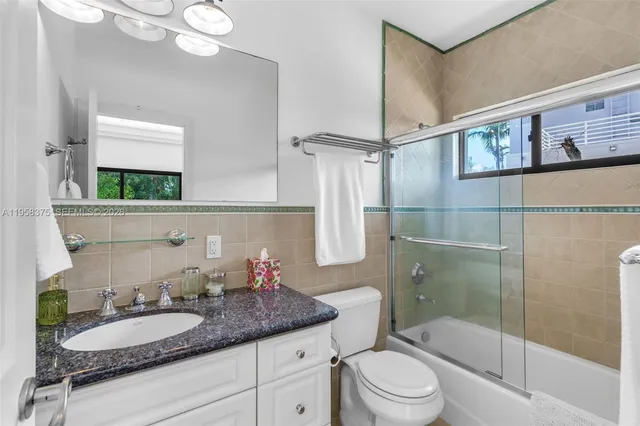 a view of livingroom and bedroom with furniture