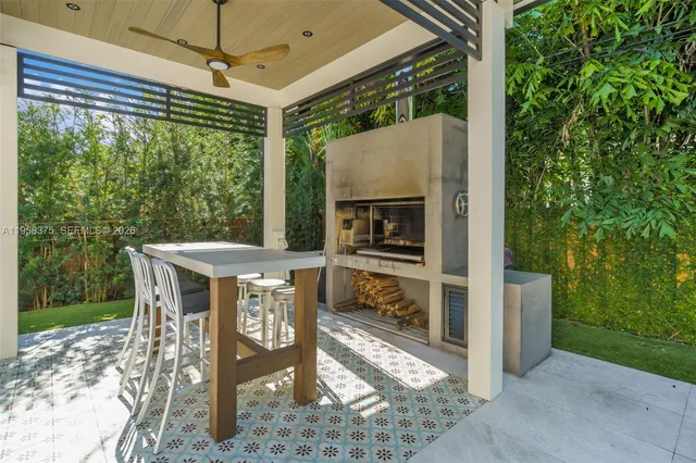 a view of a house with swimming pool and sitting area