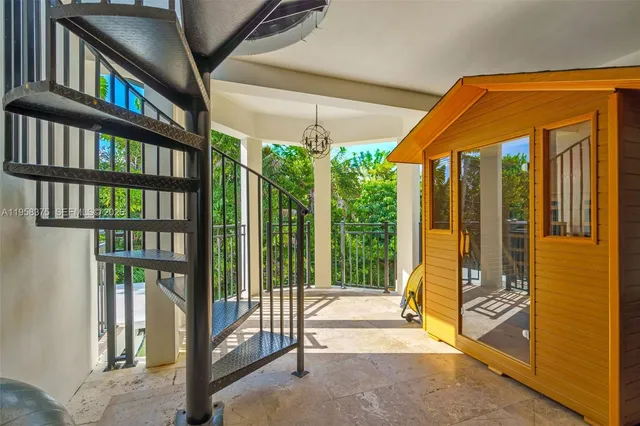 a view of a patio with table and chairs with wooden floor and fence