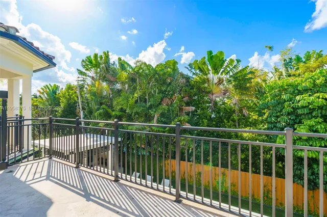 an aerial view of residential houses with city view