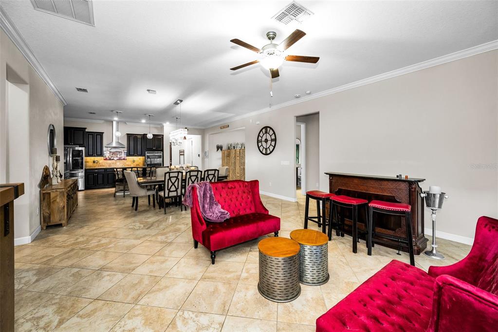 16833 Banner Shell Place Wimauma, FL 33598 - Photo 17 of 55 a living room with furniture and kitchen view
