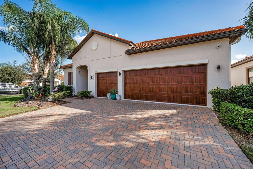 16833 Banner Shell Place Wimauma, FL 33598 - Photo 2 of 55 a front view of a house with a yard and garage