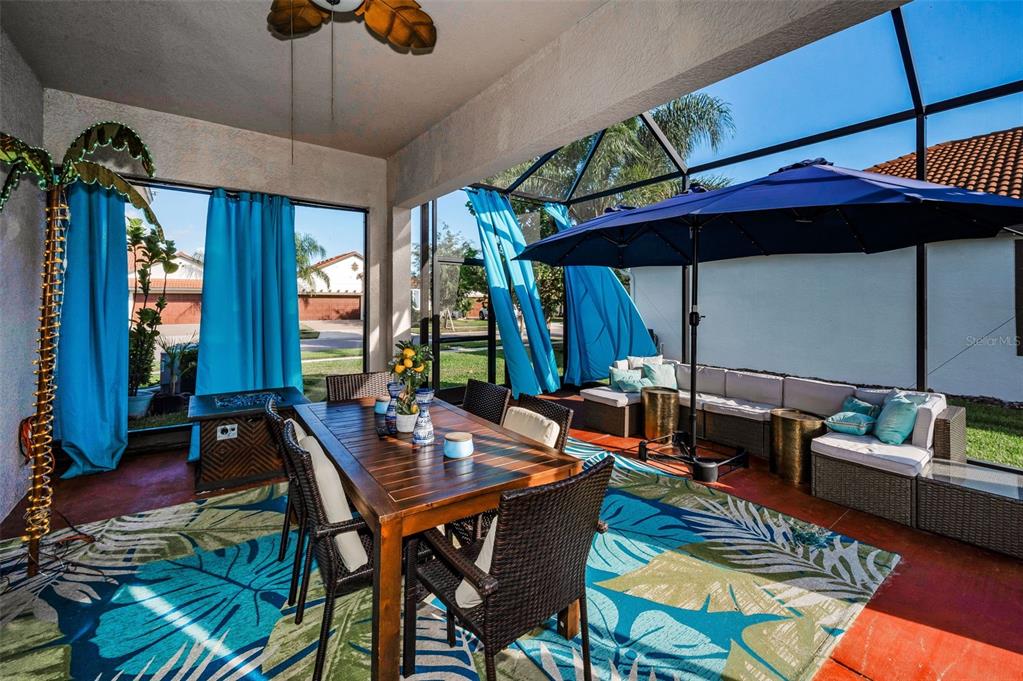 16833 Banner Shell Place Wimauma, FL 33598 - Photo 29 of 55 a view of a dining room with furniture window and wooden floor