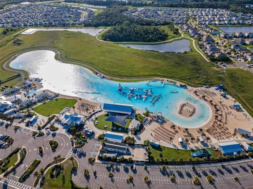 16833 Banner Shell Place Wimauma, FL 33598 - Photo 55 of 55 an aerial view of a swimming pool a yard and outdoor seating