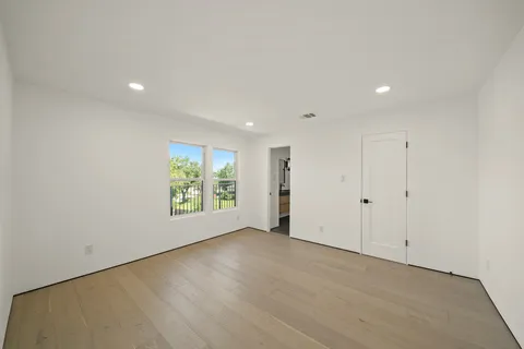 a view of room with window and hardwood floor