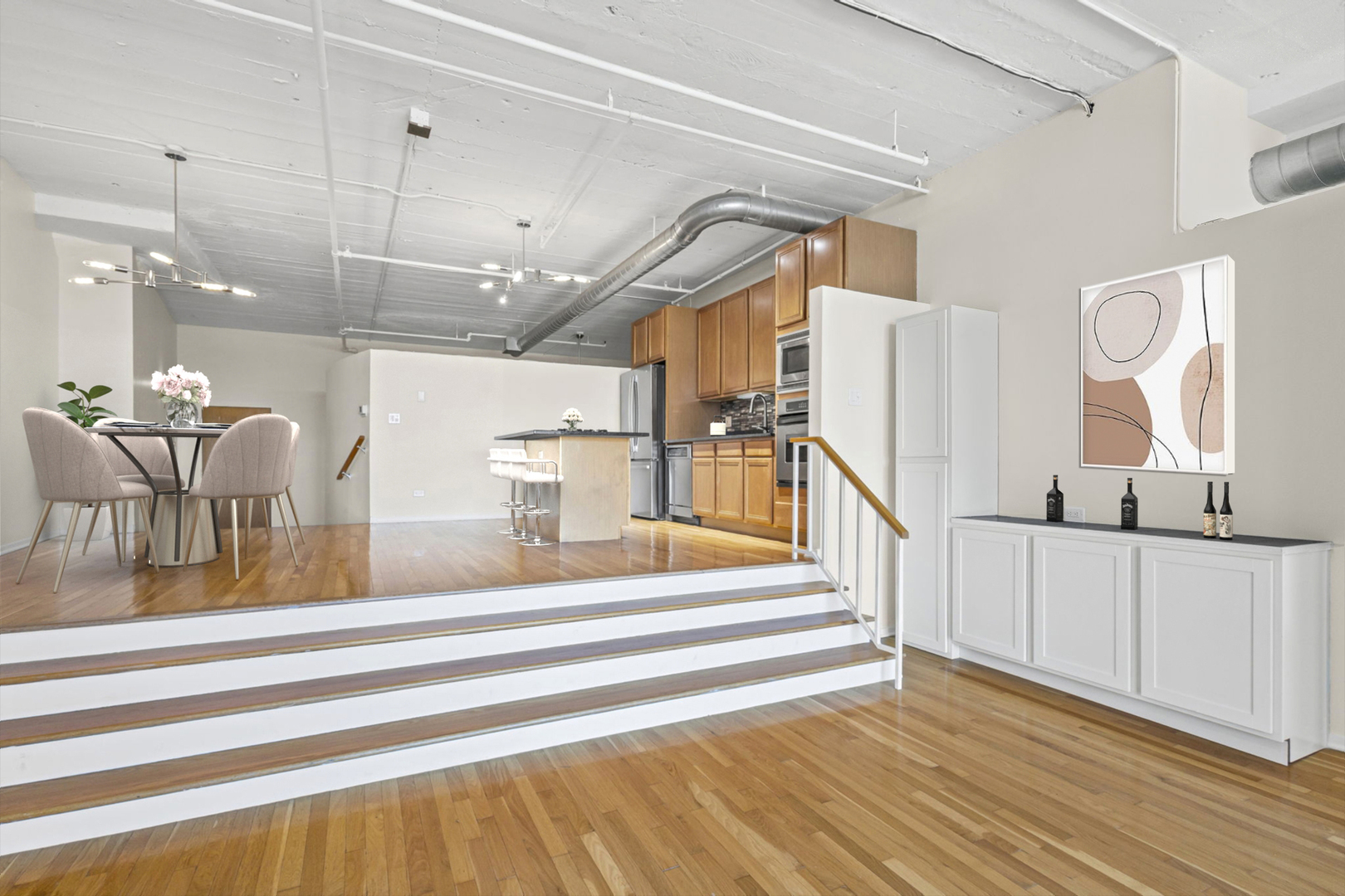 1530 South State Street, Unit 706 Chicago, IL 60605 - Photo 11 of 24 a view of staircase and living room with wooden floor