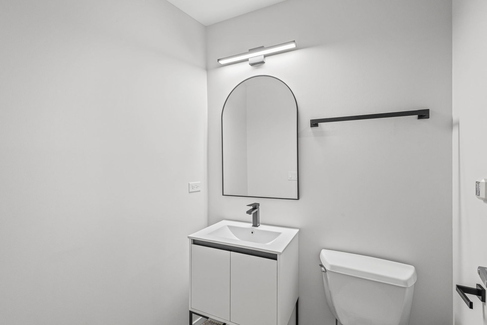 1530 South State Street, Unit 706 Chicago, IL 60605 - Photo 15 of 24 a bathroom with a sink a toilet and a mirror
