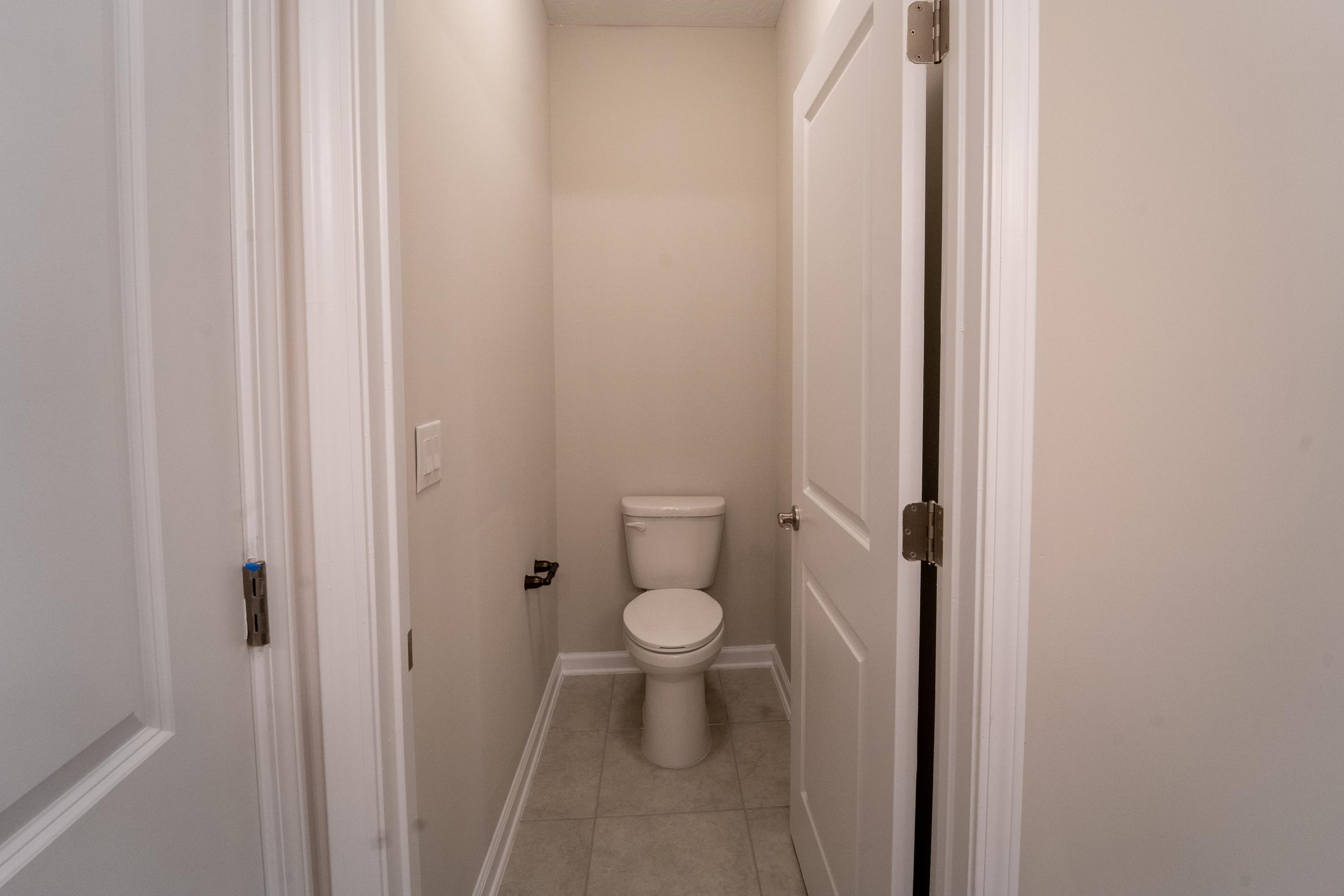 298 Modesto Drive St. Augustine, FL 32086 - Photo 11 of 28 a bathroom with a toilet and a sink