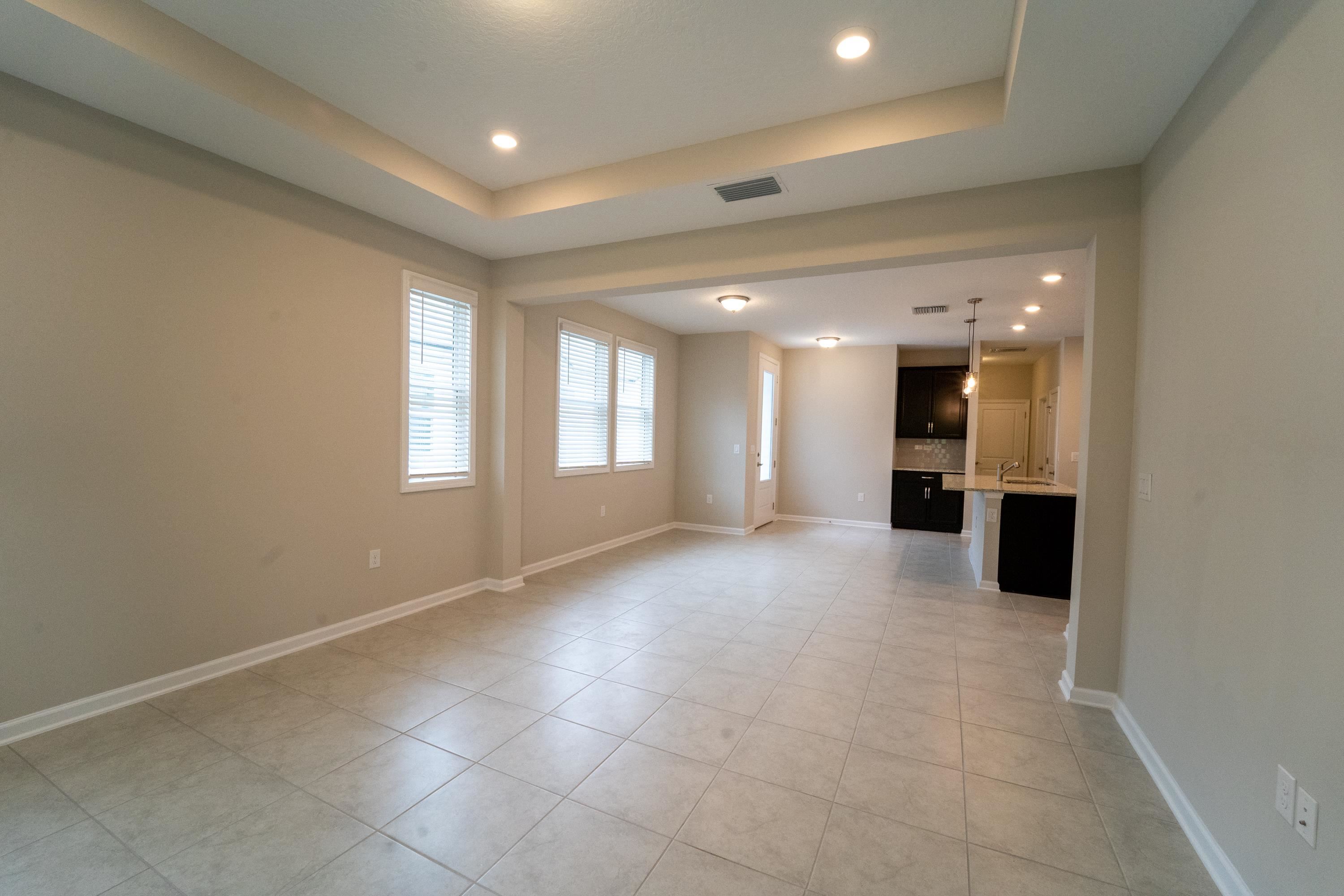 298 Modesto Drive St. Augustine, FL 32086 - Photo 15 of 28 a view of a big room with windows and a projector room