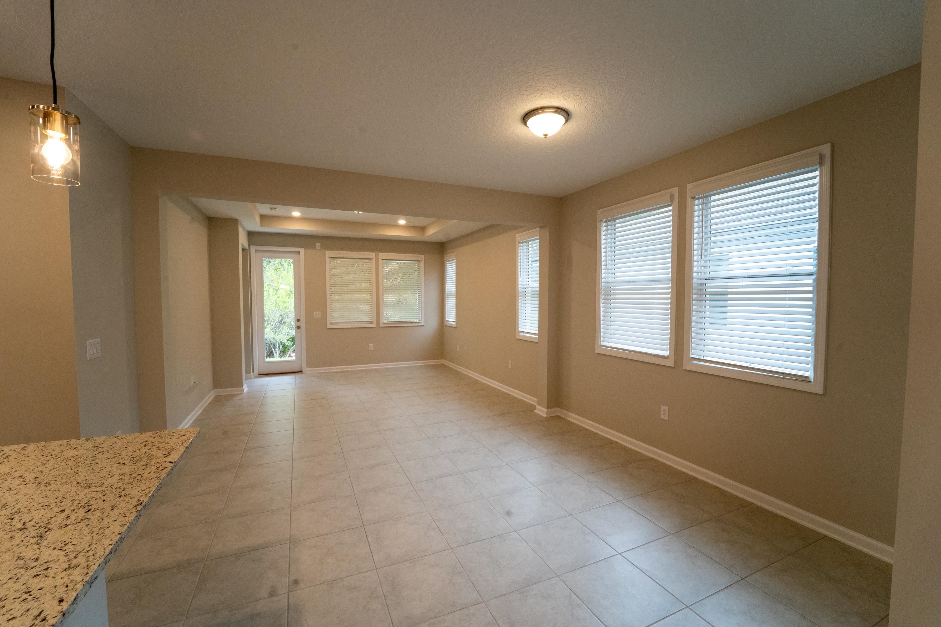 298 Modesto Drive St. Augustine, FL 32086 - Photo 6 of 28 a view of an empty room with a window