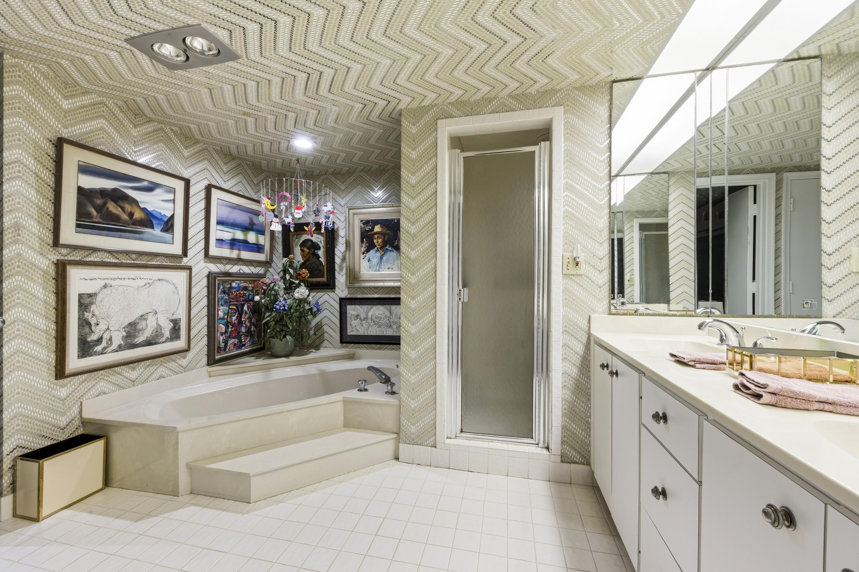 3300 South Ocean Boulevard, Unit 103S Palm Beach, FL 33480 - Photo 12 of 20 a spacious bathroom with a tub sink and mirror