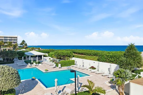 a view of house with outdoor space and seating