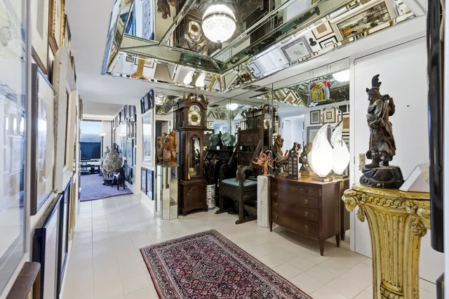 a view of a hallway with a tv