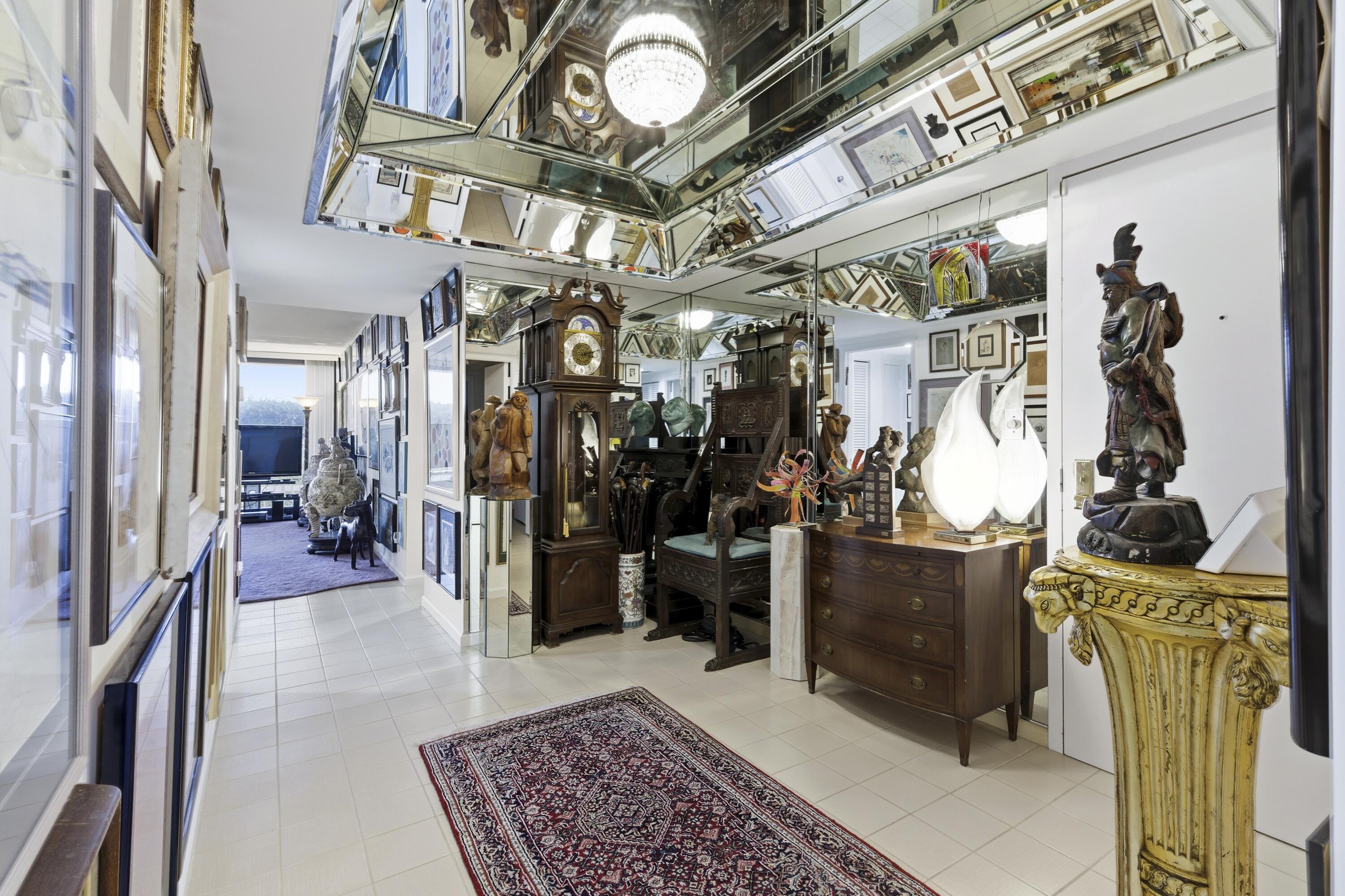 3300 South Ocean Boulevard, Unit 103S Palm Beach, FL 33480 - Photo 10 of 20 a view of a hallway with a tv