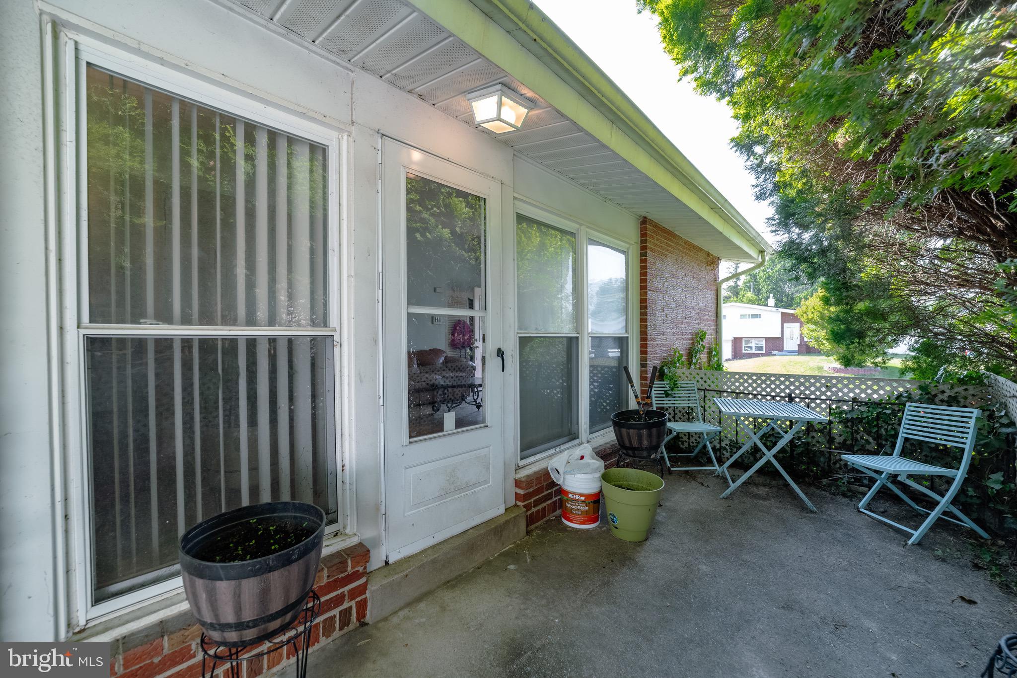 4125 Ronis Road Pikesville, MD 21208 - Photo 32 of 40 a view of a patio with table and chairs and potted plants