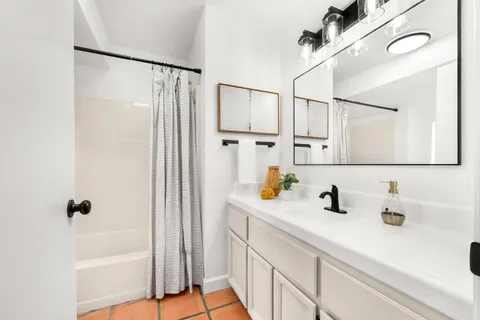 a bathroom with a sink and a shower
