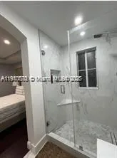 a living room with a bed and furniture