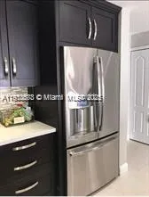 a kitchen with stainless steel appliances granite countertop a sink and a stove