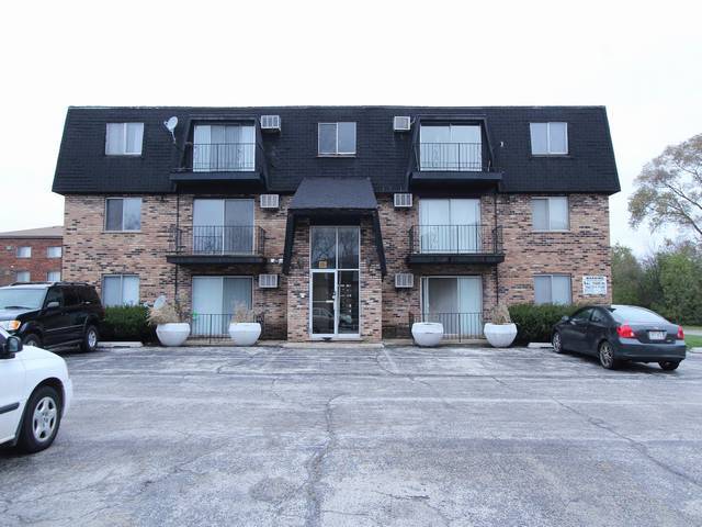 4839 West Engle Road, Unit 2D Alsip, IL 60803 - Photo 14 of 16 a front view of a house with parking space