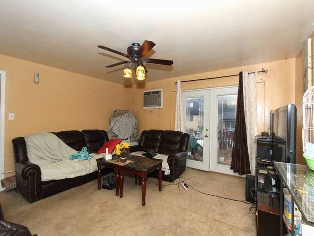 4839 West Engle Road, Unit 2D Alsip, IL 60803 - Photo 3 of 16 a living room with furniture and a window