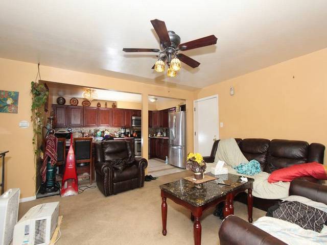 4839 West Engle Road, Unit 2D Alsip, IL 60803 - Photo 4 of 16 a living room with furniture and a flat screen tv