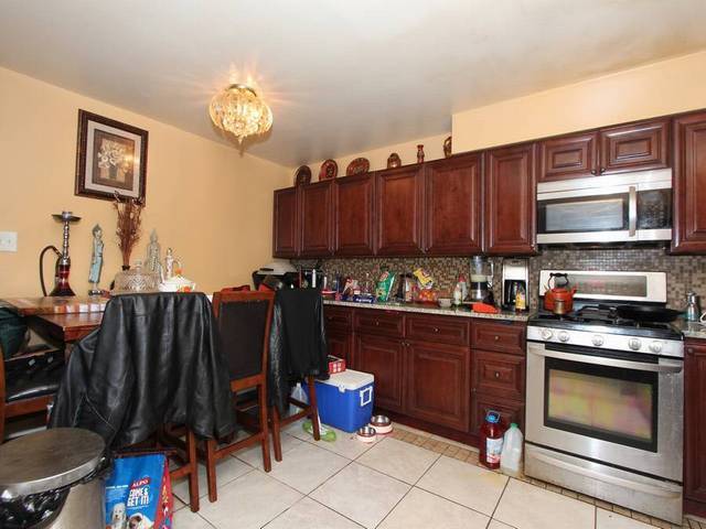 4839 West Engle Road, Unit 2D Alsip, IL 60803 - Photo 6 of 16 a kitchen with a sink and cabinets