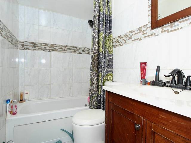 4839 West Engle Road, Unit 2D Alsip, IL 60803 - Photo 9 of 16 a bathroom with a sink a toilet and shower