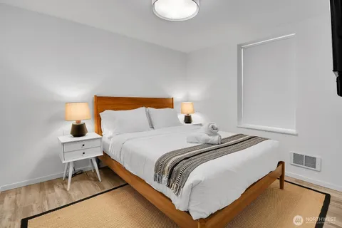 a bedroom with a bed and a chair