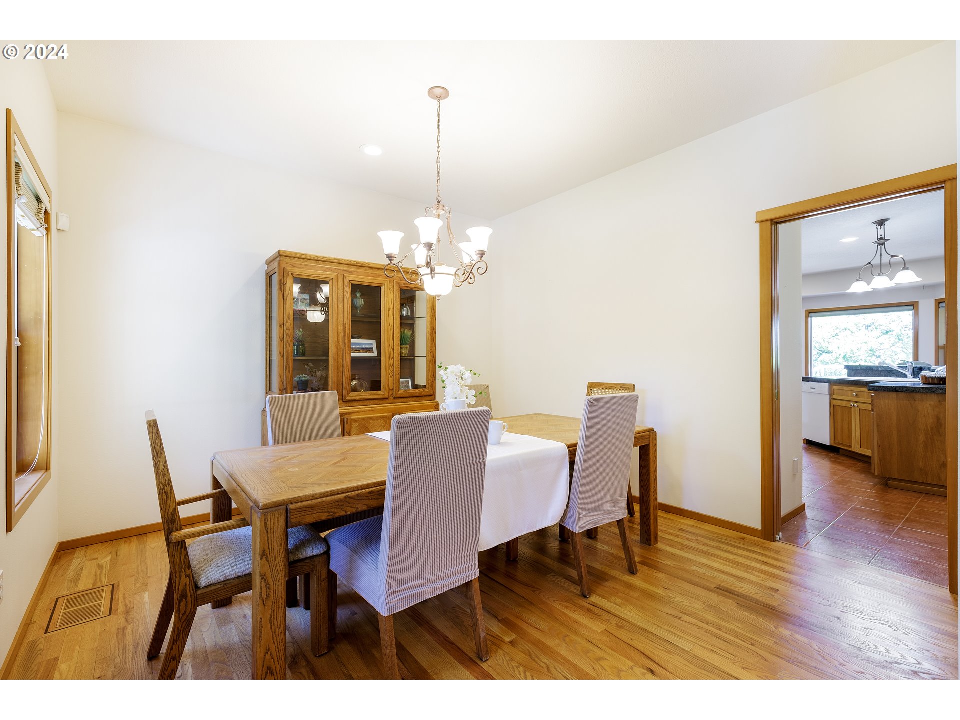 10202 South New Era Road Canby, OR 97013 - Photo 24 of 48 a view of a dining room with furniture and wooden floor