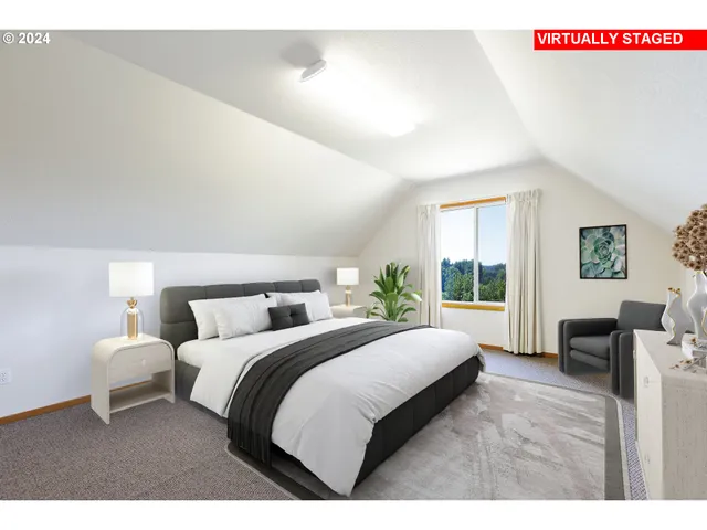 a bedroom with a large bed and a window