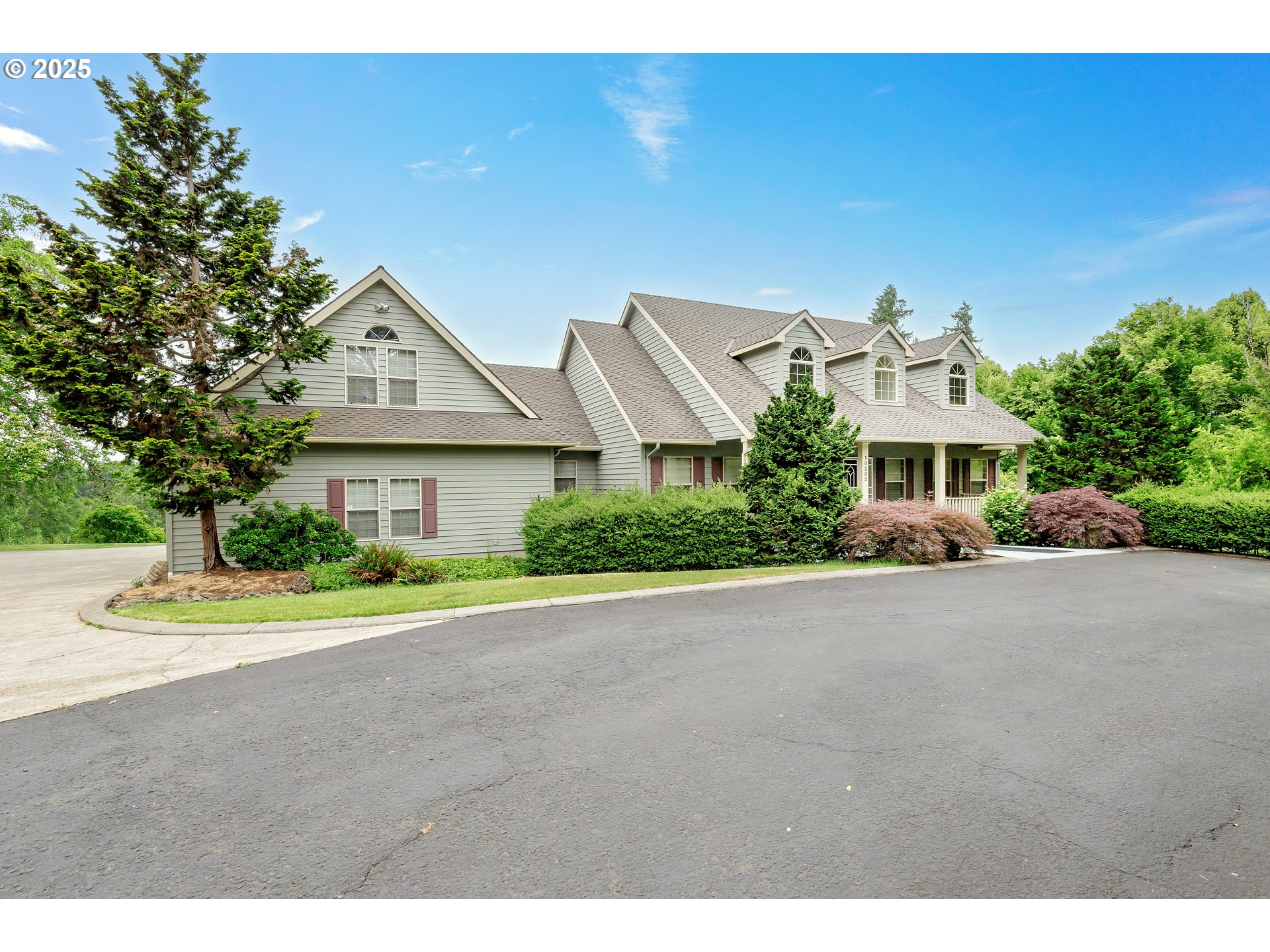 10202 South New Era Road Canby, OR 97013 - Photo 4 of 48 a front view of a house with a yard and garage
