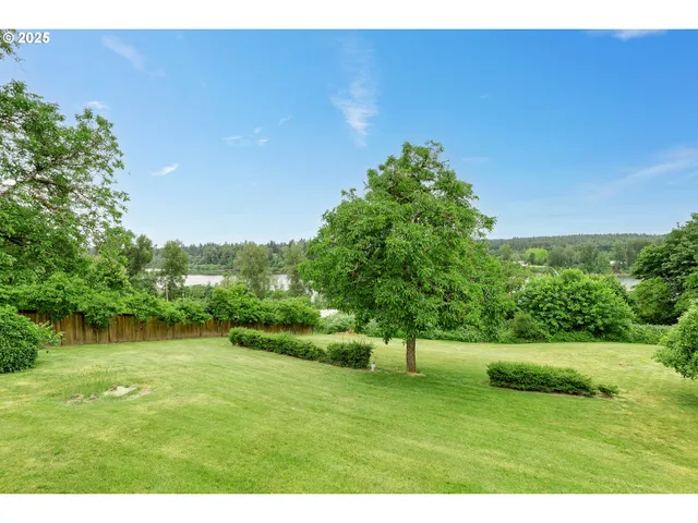 a view of a balcony with yard