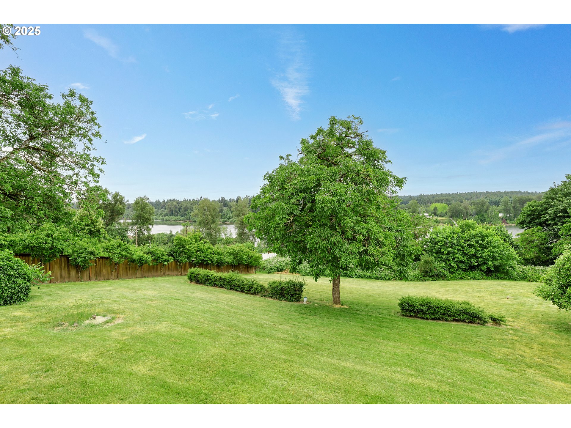 10202 South New Era Road Canby, OR 97013 - Photo 41 of 48 a view of a green field with wooden fence