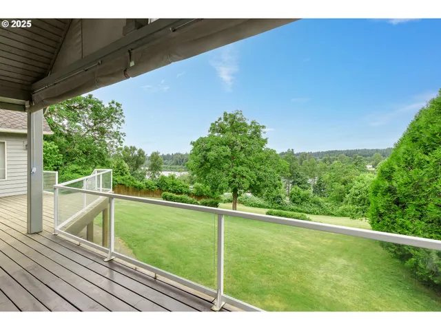 a view of deck with patio and yard