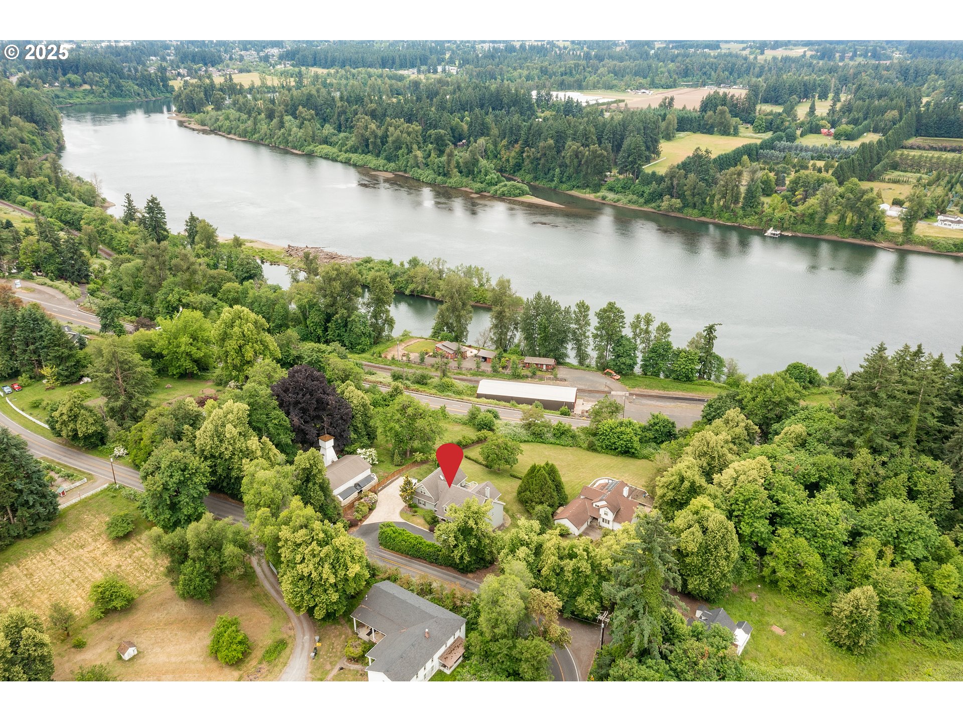 10202 South New Era Road Canby, OR 97013 - Photo 45 of 48 an aerial view of residential houses with outdoor space and lake view
