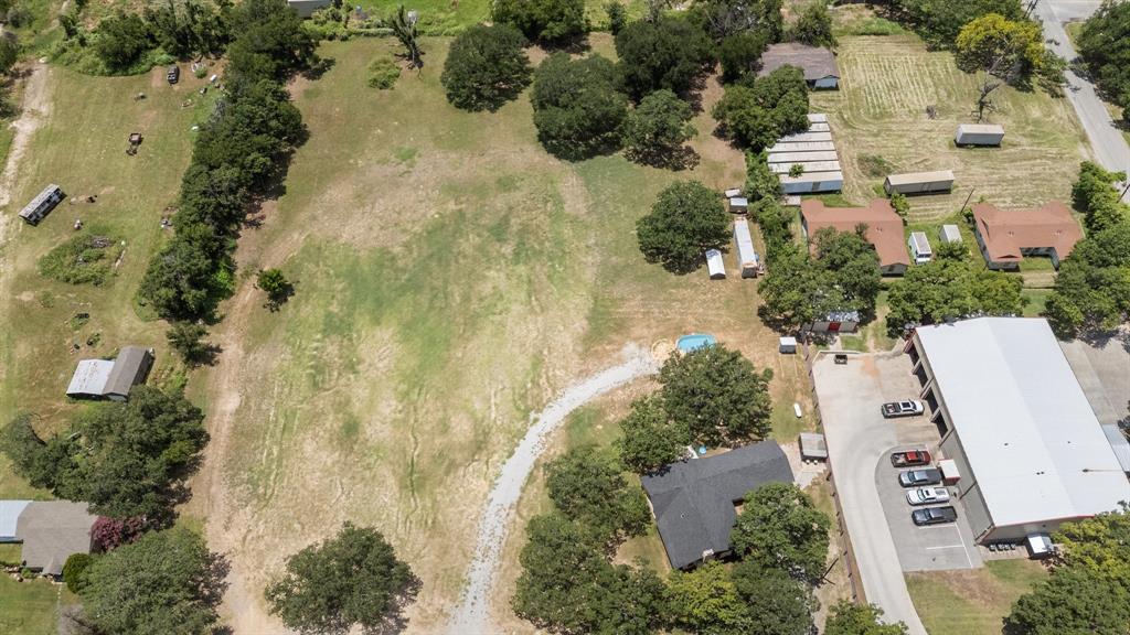 220 South Ash Street Springtown, TX 76082 - Photo 11 of 40 an aerial view of a house with a yard