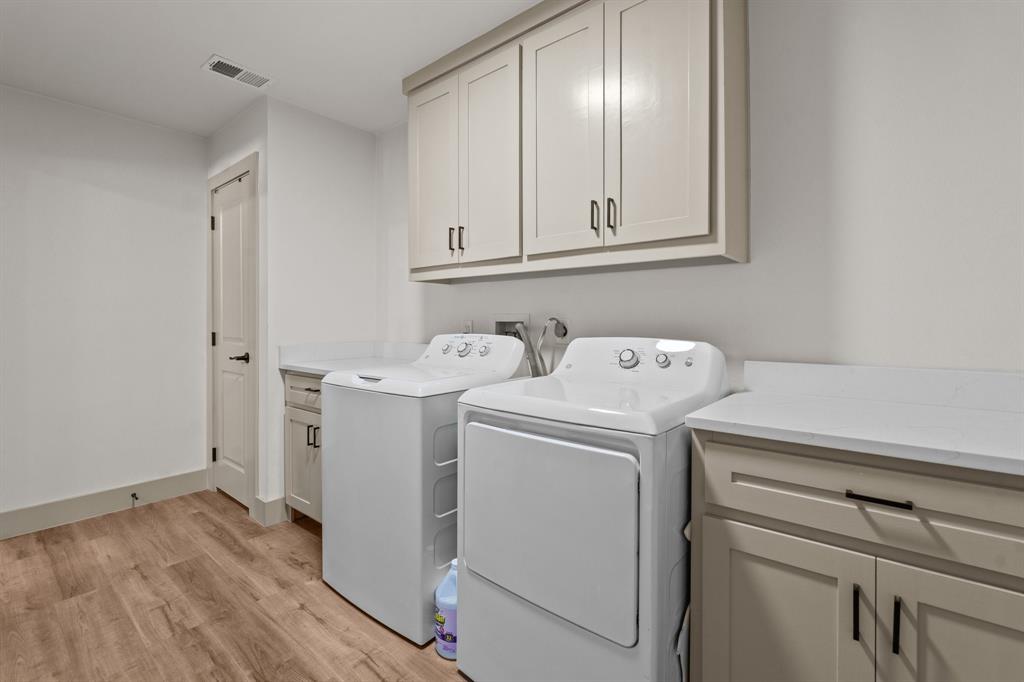 220 South Ash Street Springtown, TX 76082 - Photo 25 of 40 a utility room with dryer and washer