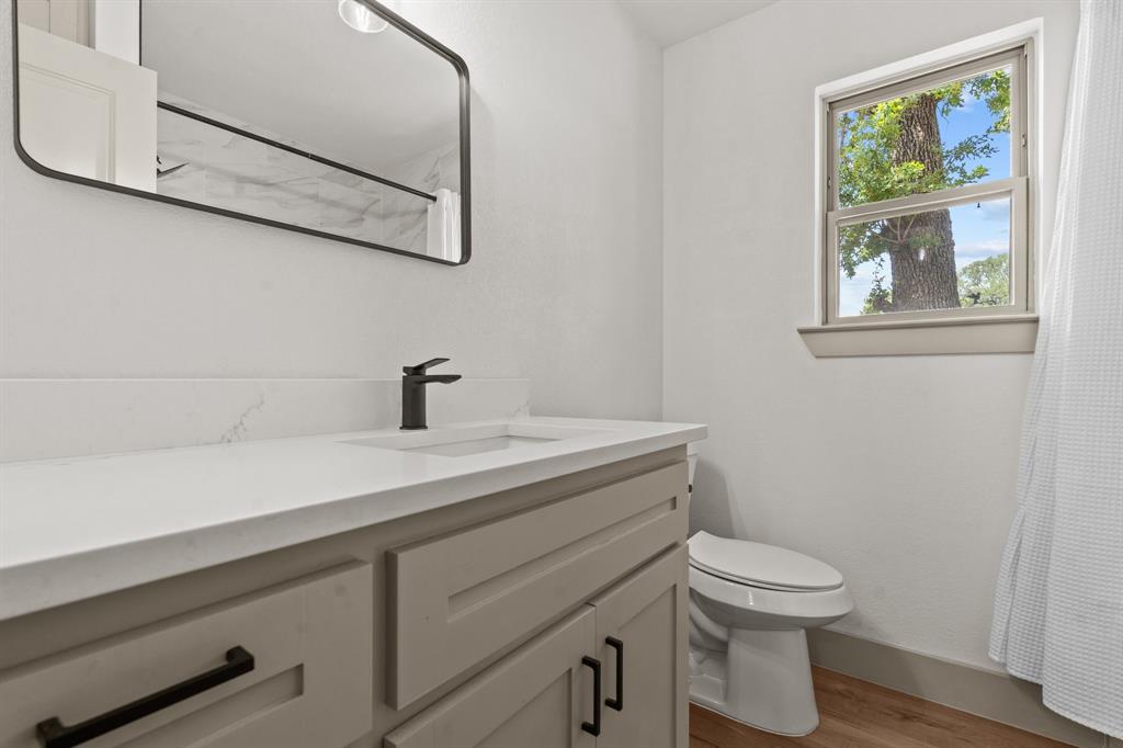 220 South Ash Street Springtown, TX 76082 - Photo 30 of 40 a view of bathroom with a sink