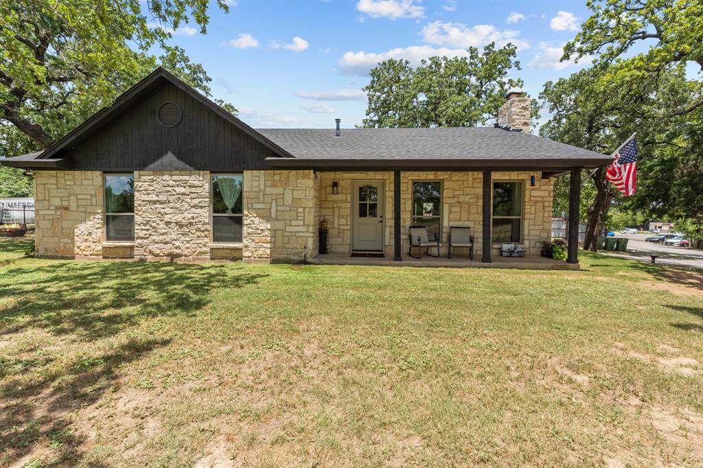 220 South Ash Street Springtown, TX 76082 - Photo 4 of 40 a view of a house with a yard
