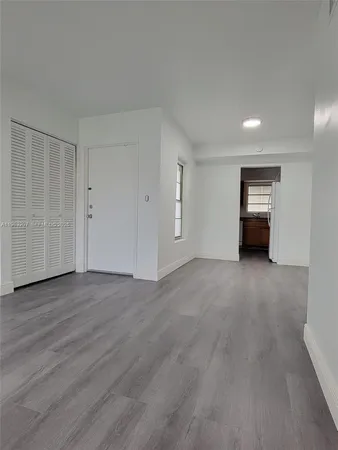 a view of a livingroom with wooden floor