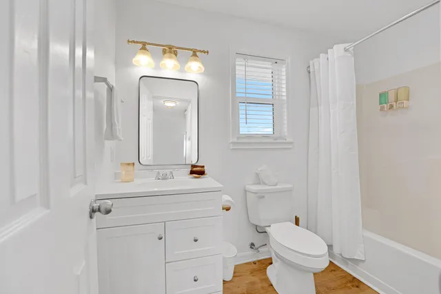 a bedroom with bed and window