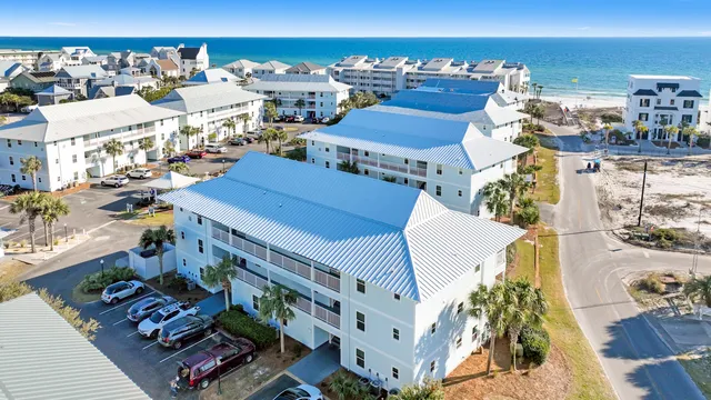 an aerial view of a house with a ocean view