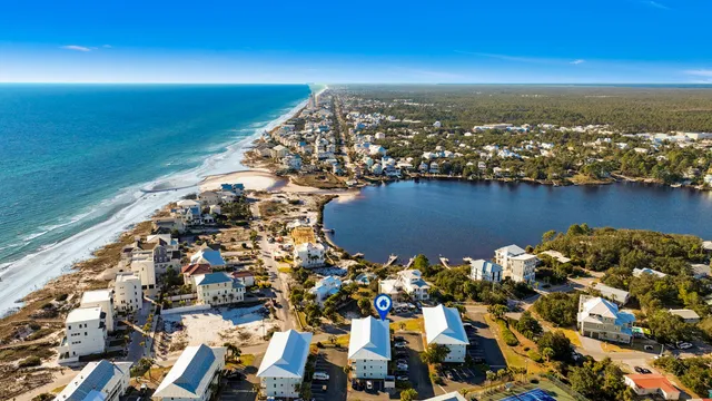 an aerial view of residential building and lake