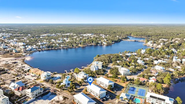 an aerial view of multiple house with yard