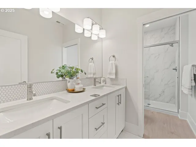 a bathroom with a sink a vanity and a mirror