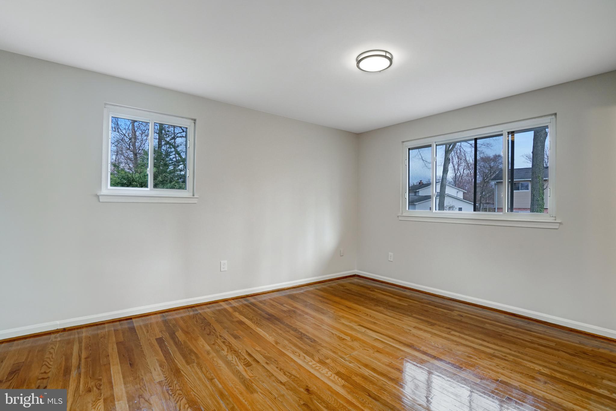 8941 Burke Lake Road Springfield, VA 22151 - Photo 14 of 34 a view of empty room with wooden floor