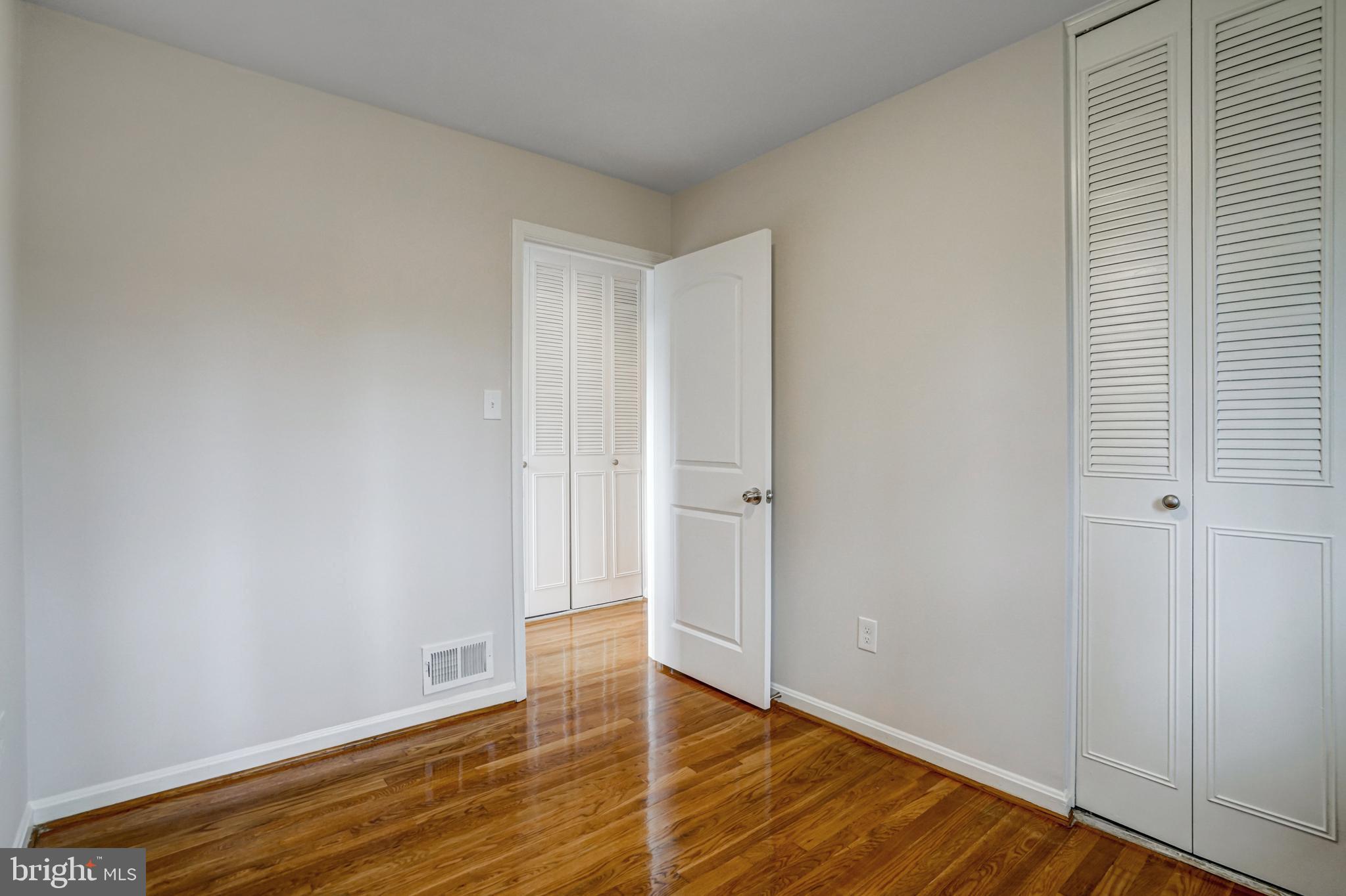 8941 Burke Lake Road Springfield, VA 22151 - Photo 24 of 34 a view of an empty room and wooden floor